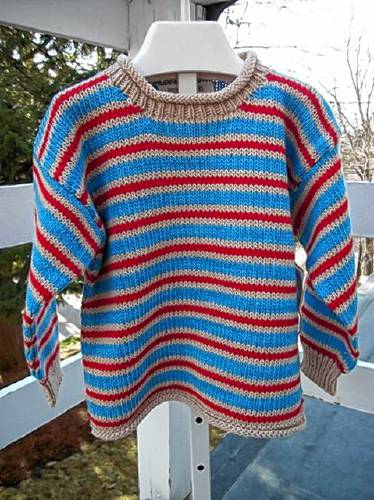 A handknit child’s sweater from Buddie Sweaters. 