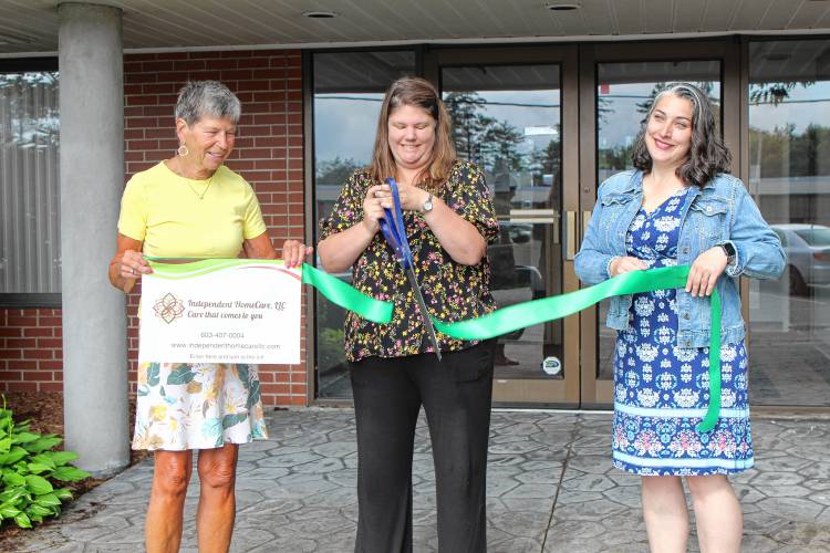 Jaffrey Chamber of Commerce Director Cyndy Burgess, Independent HomeCare owner and manager Shannon Tremblay and TEAM Jaffrey Director Tarah Castiglioni cut the ribbon for new offices for Independent HomeCare on Thursday morning.