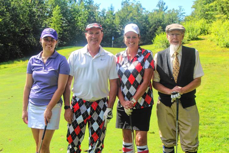 Abby Wheeler, Ben Wheeler, Ann Wheeler and Randy Cournoyer all wore vintage garb for the the Vintage Golf Classic on Monday.