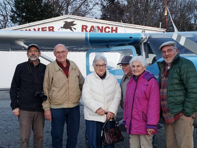 From left, David McQueen, Harvey Sawyer, Eleanor McQueen, Joe and Marcie Manning (recipients of a prior flight) and Monadnock at Home/CVTC driver Owen Houghton gather at Silver Ranch Airpark after Eleanor McQueen’s “golden flight” over the Monadnock region.