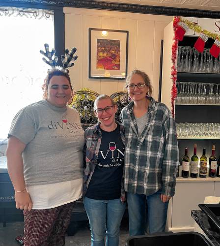 Lisa Walker, right, with her helpers at Divine on Main wine bar in Peterborough.