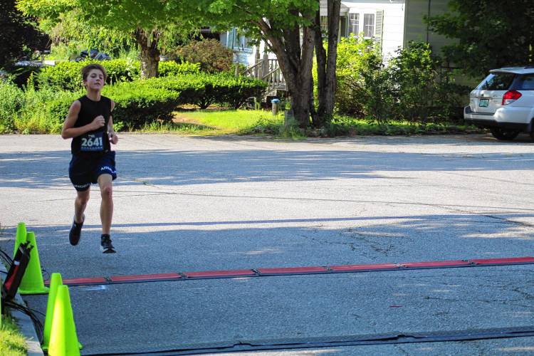 Rolando Dumont of Rindge pushes across the finish for a 12th-place finish.