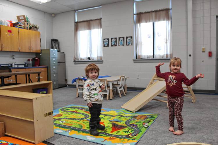 Arlo Gravell and Mya Cote enjoy free play in the day care’s playroom.