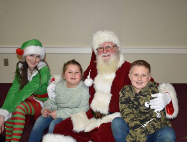 Santa and his elf with some children from Jaffrey.