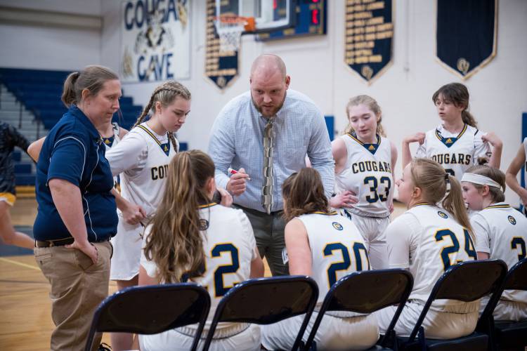 ConVal girls' basketball head coach Kyle Murray talks to his team before their game against Bow in Peterborough on Friday, Dec. 22.