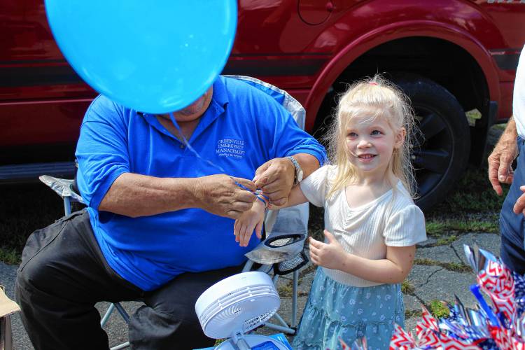Millie Jenks, 4, of Peterborough, gets a balloon for her wrist.