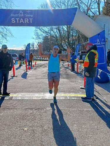 Gavin Ketola crosses the finish line as the overall winner of the Peanut Butter Chip Chase on Jan. 1 in Temple.
