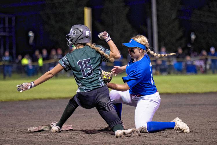 Leah St. John slaps on a tag at third as Woodsville's Allee Rowe slides in.