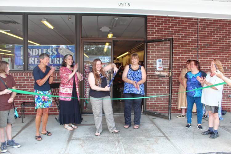 Angela Johnson cuts the ribbon on the Jaffrey location of Endless Treasures on July 1.