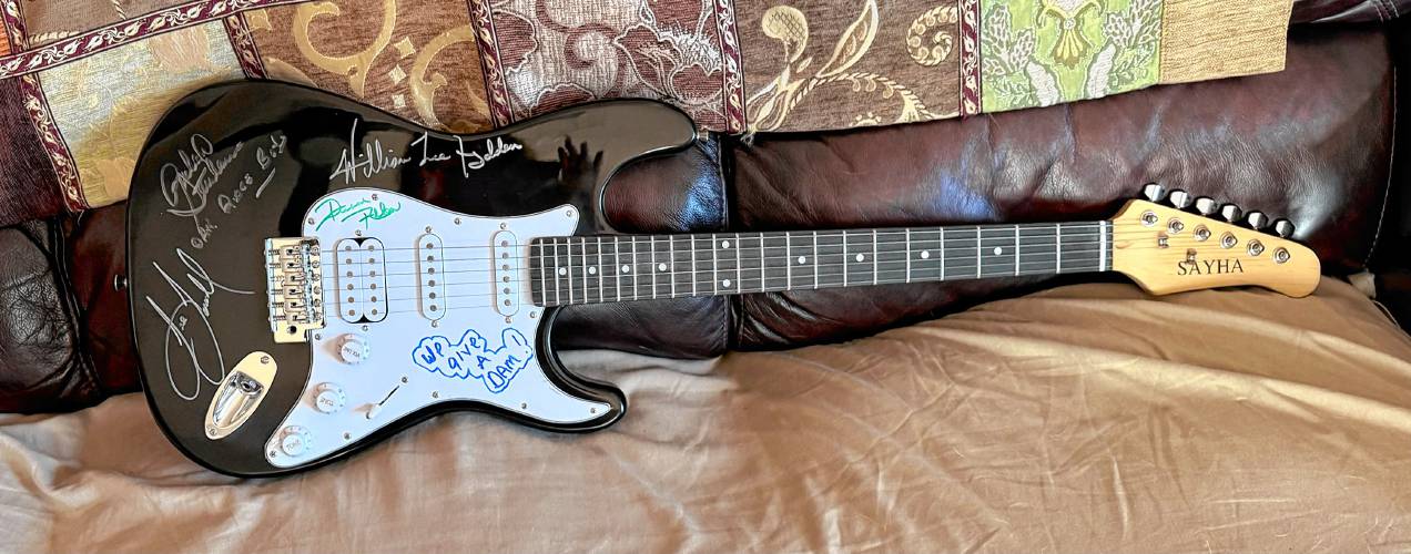 A guitar signed by The Oak Ridge Boys is one of the items in the silent auction.