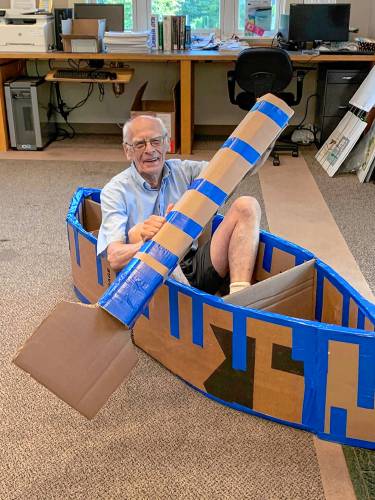 David Bridgewater demonstrates the library’s entry in the Sunset Lake cardboard regatta in summer 2023. 