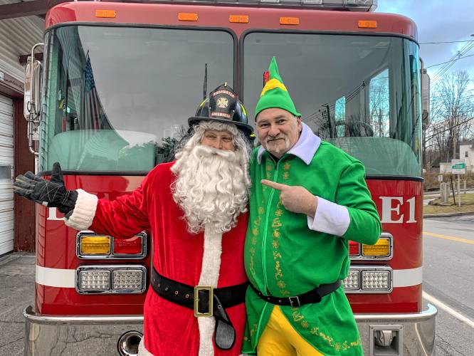 New Ipswich and Greenville firefighter Jim Feldhusen as Firefighter Santa with Buddy the Elf, played by firefighter Charlie Jackman.