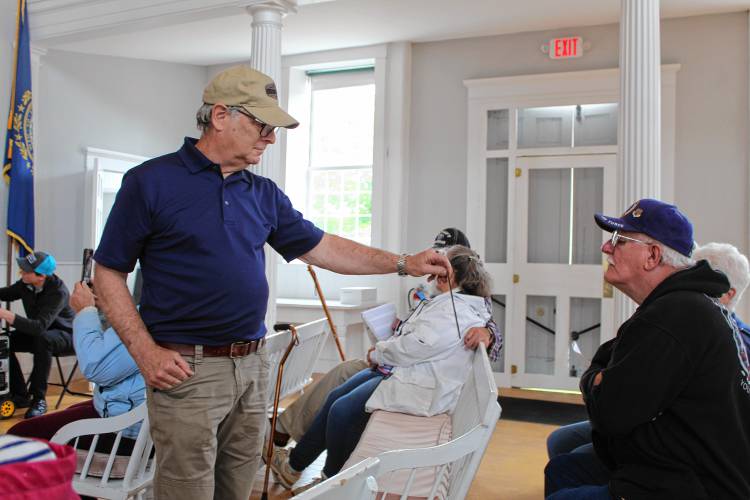 Photographs of some of the veterans who are buried in the Jaffrey Meetinghouse Old Burying Ground were shown to the crowd at a recent tour.