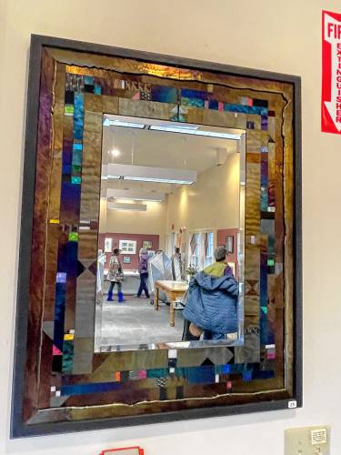 A handmade glass mosaic mirror by Hancock artist Thomas Meyer. 