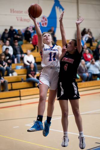 Mascenic's Siena Gregory goes for a layup against Newmarket.