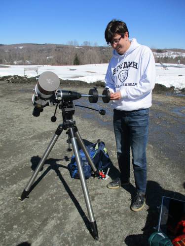 Dublin School science teacher Matthew Saveliev sets up the school’s solar scope for viewing the partial eclipse phase.