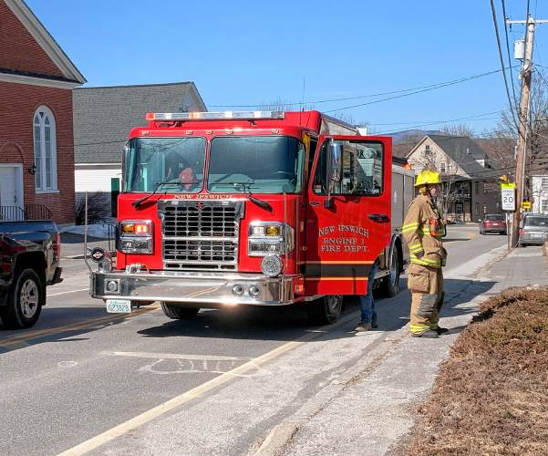 New Ipswich fire crews assist at a house fire in Greenville on Saturday.